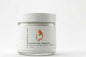Jar of Empression Nourishing Body Cream with a white label on a light gray background